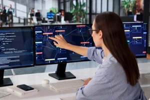 woman uses visual software, building node-based dolutions