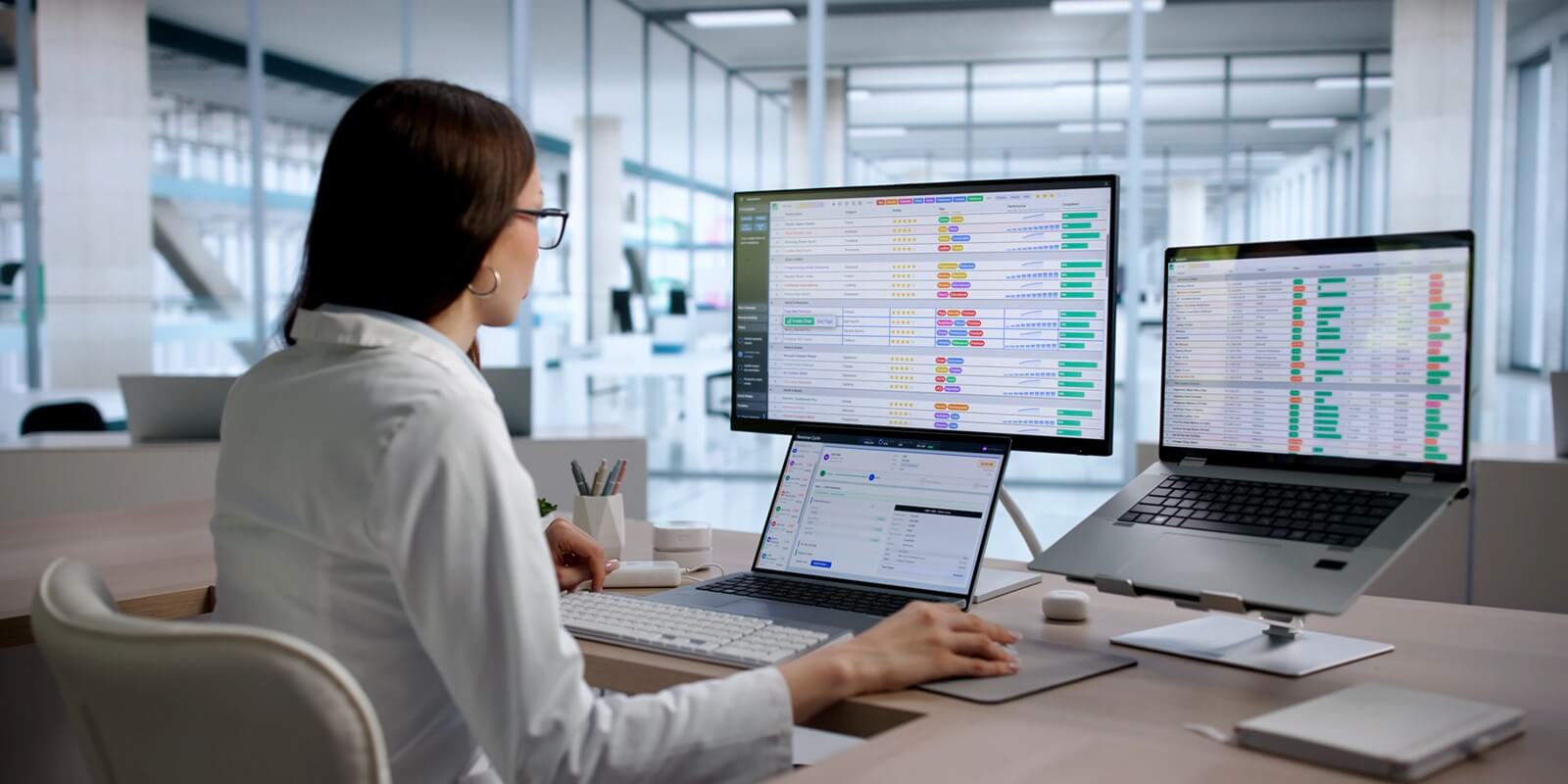 young woman medical coding specialist reviews billing data